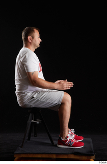  Louis  2 dressed grey shorts red sneakers sitting sports white t shirt whole body 0013.jpg